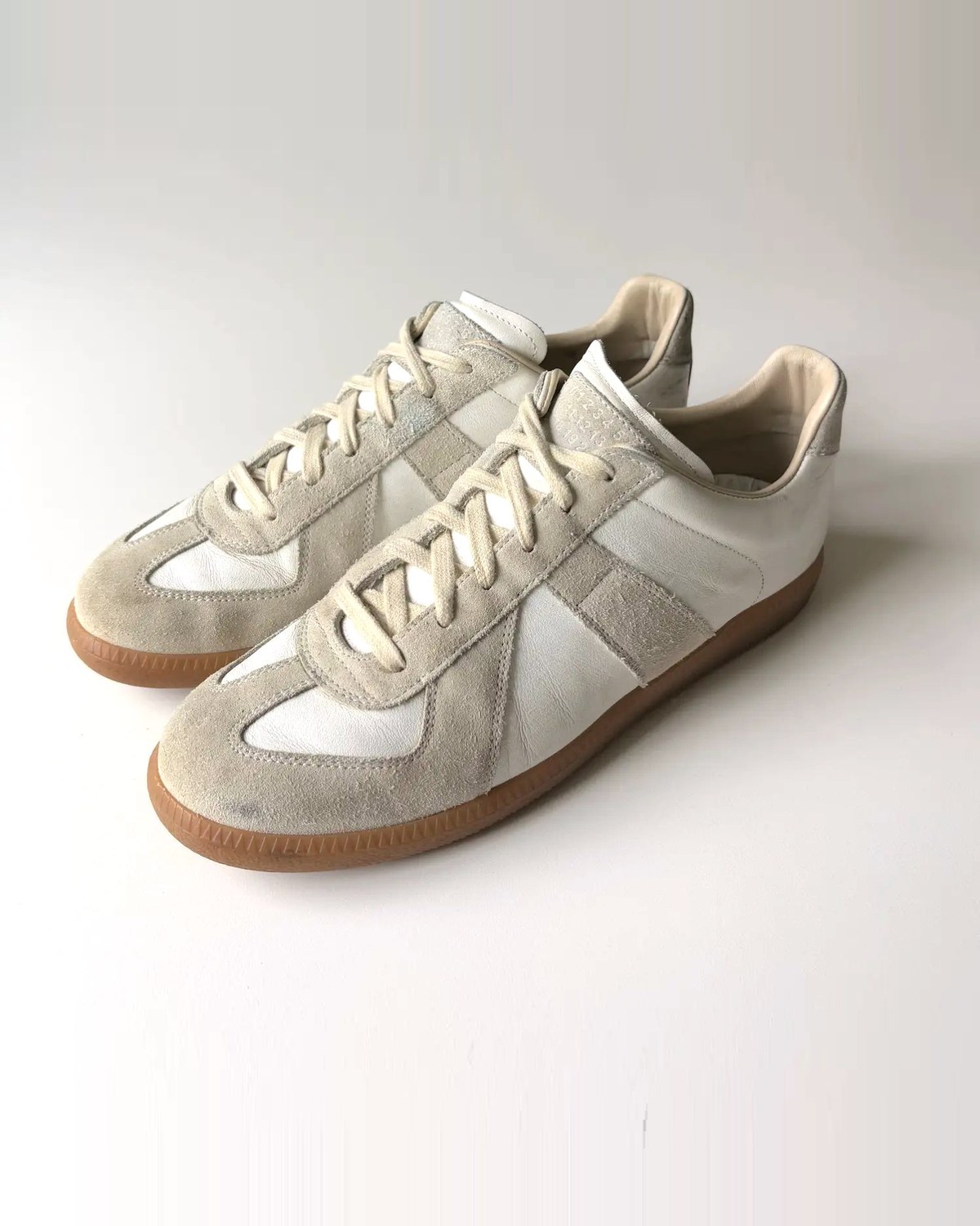 White GAT trainers side view